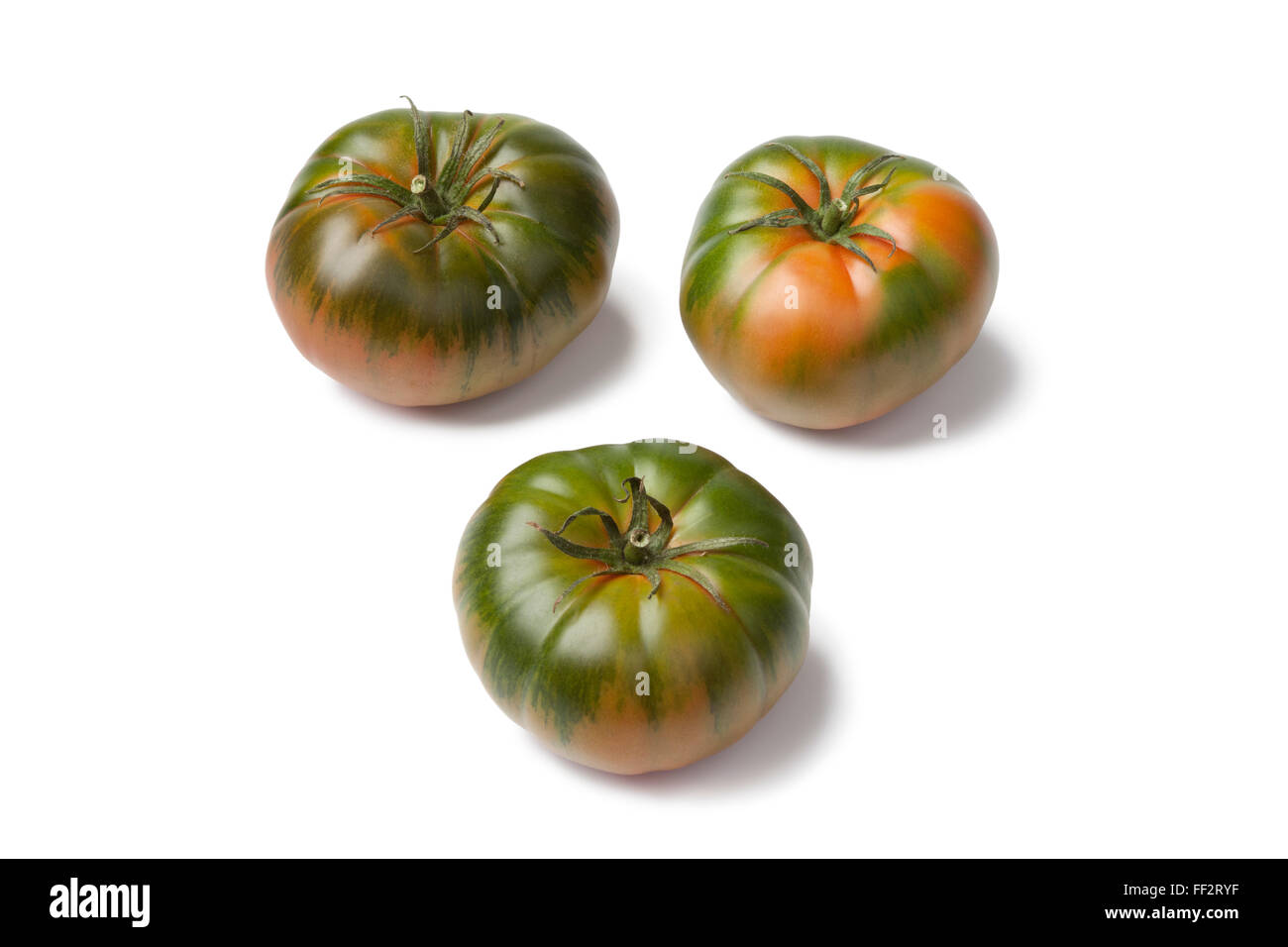 RAF frais heirloom tomatoes on white background Banque D'Images