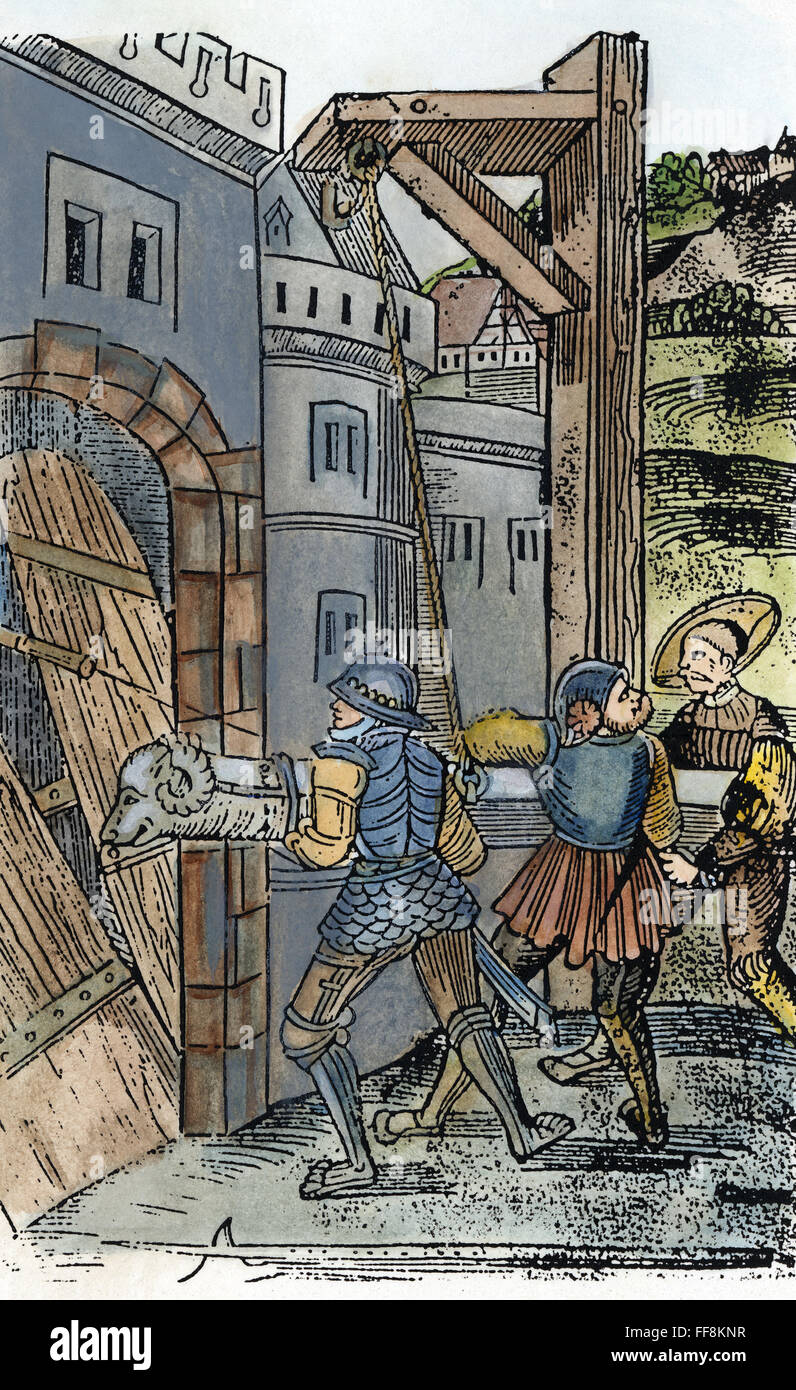 Bélier, 1529. /NSoldiers franchir la porte d'une ville avec un bélier.  Gravure sur bois, Allemand, 1529 Photo Stock - Alamy