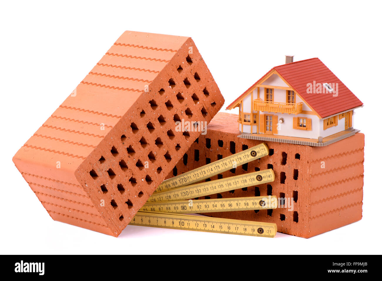 La brique pour la construction d'une maison et l'outil avec model house Banque D'Images