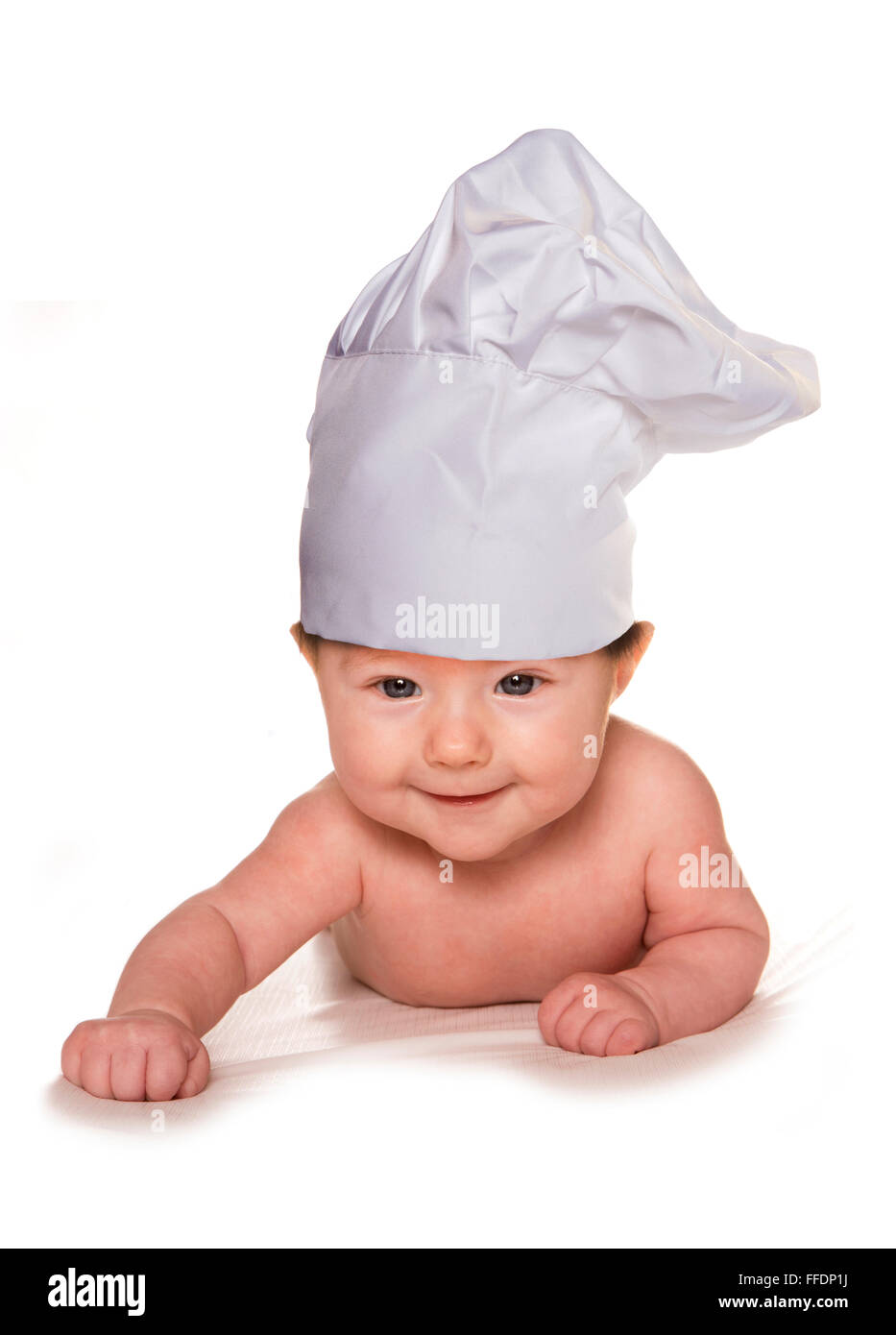 Bébé de trois mois portant découpe chef hat Banque D'Images