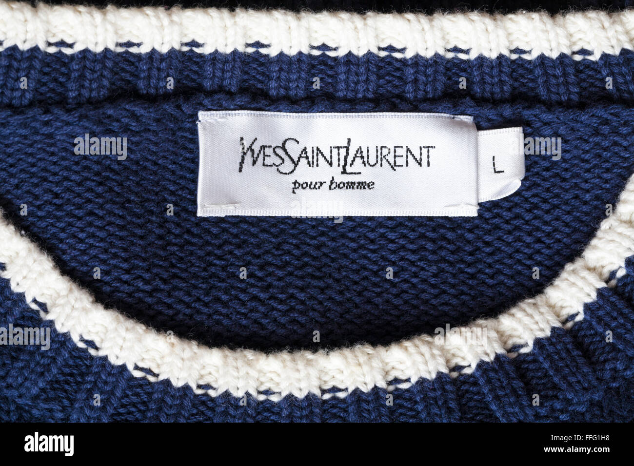Yves Saint Laurent pour homme étiquette dans man's jumper Photo Stock ...