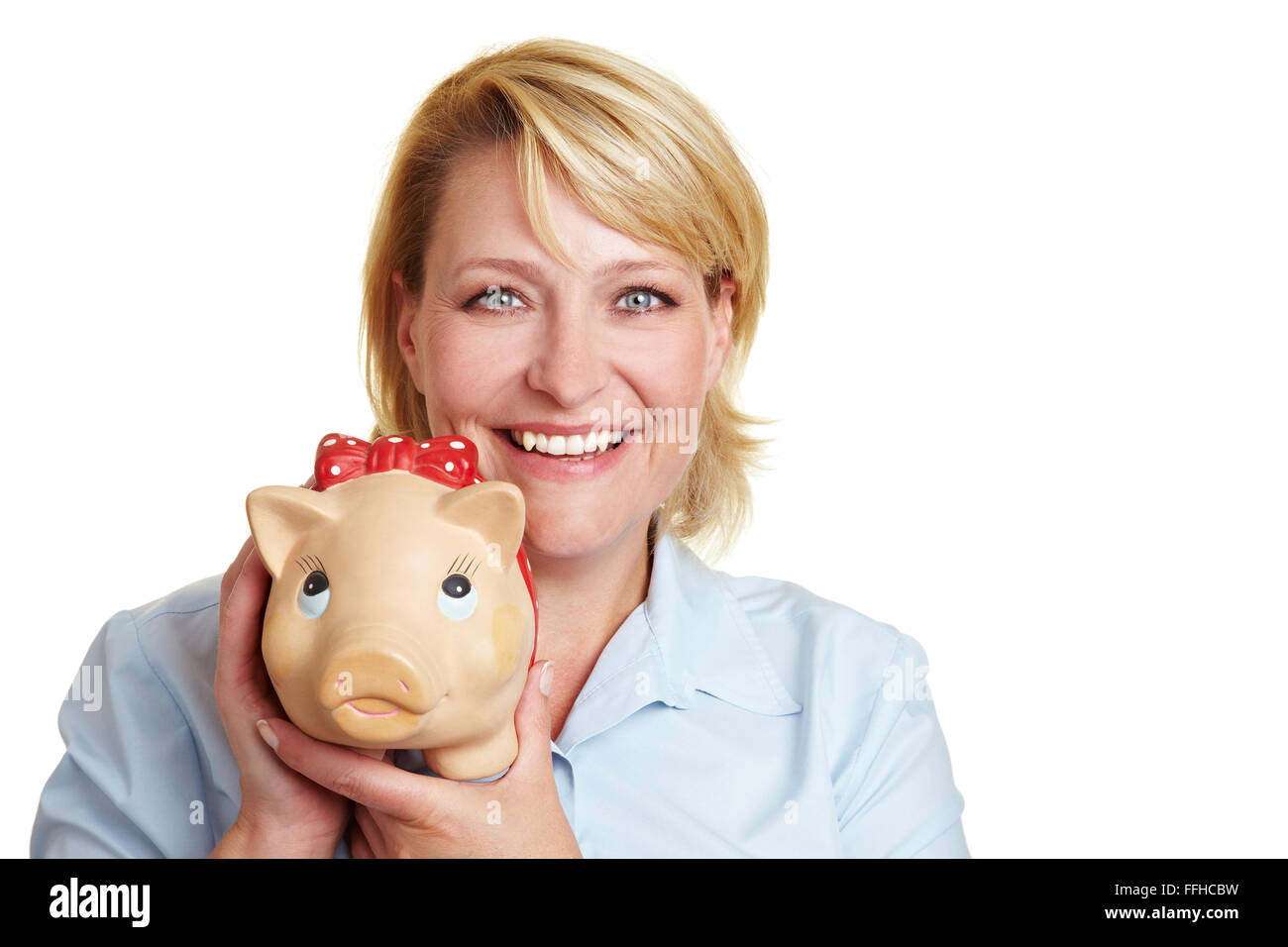 Happy business woman carrying a big piggy bank Banque D'Images
