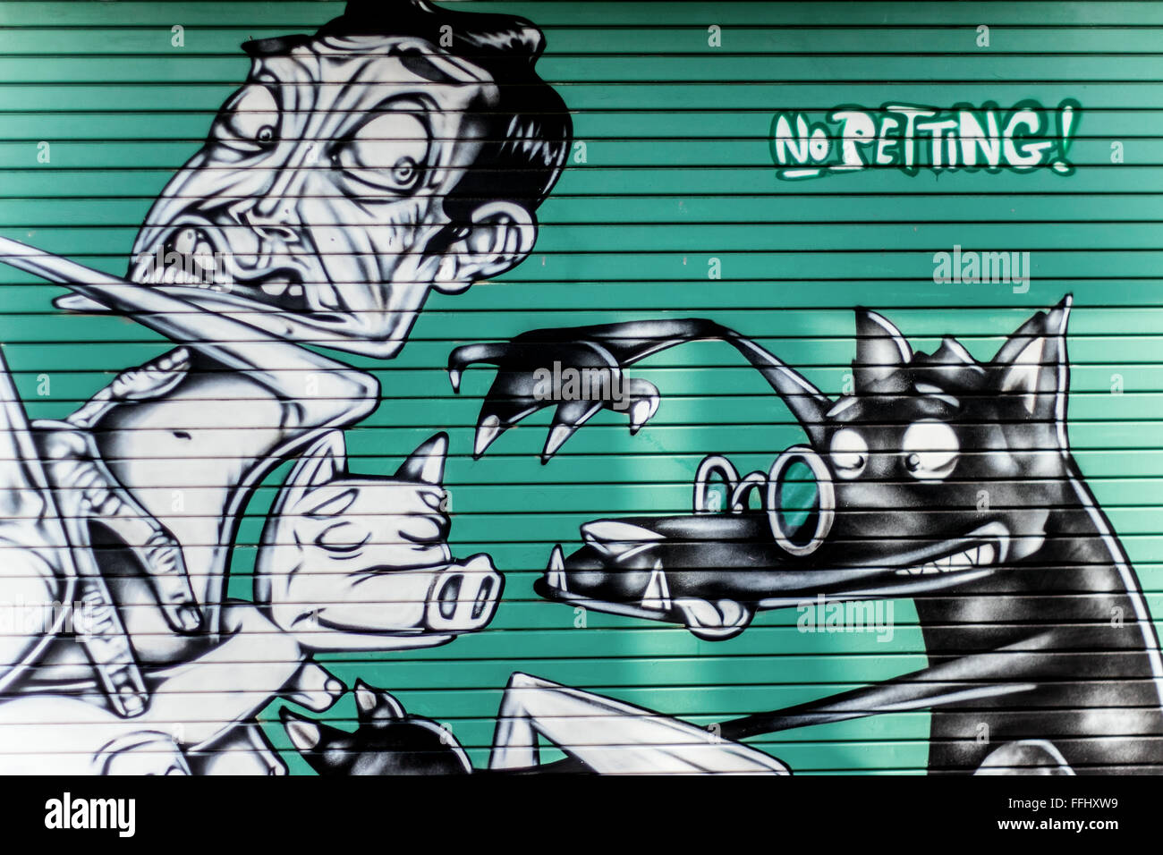 Pas de Street Art pour enfants sur porte de garage à St Phillips, Bristol Banque D'Images