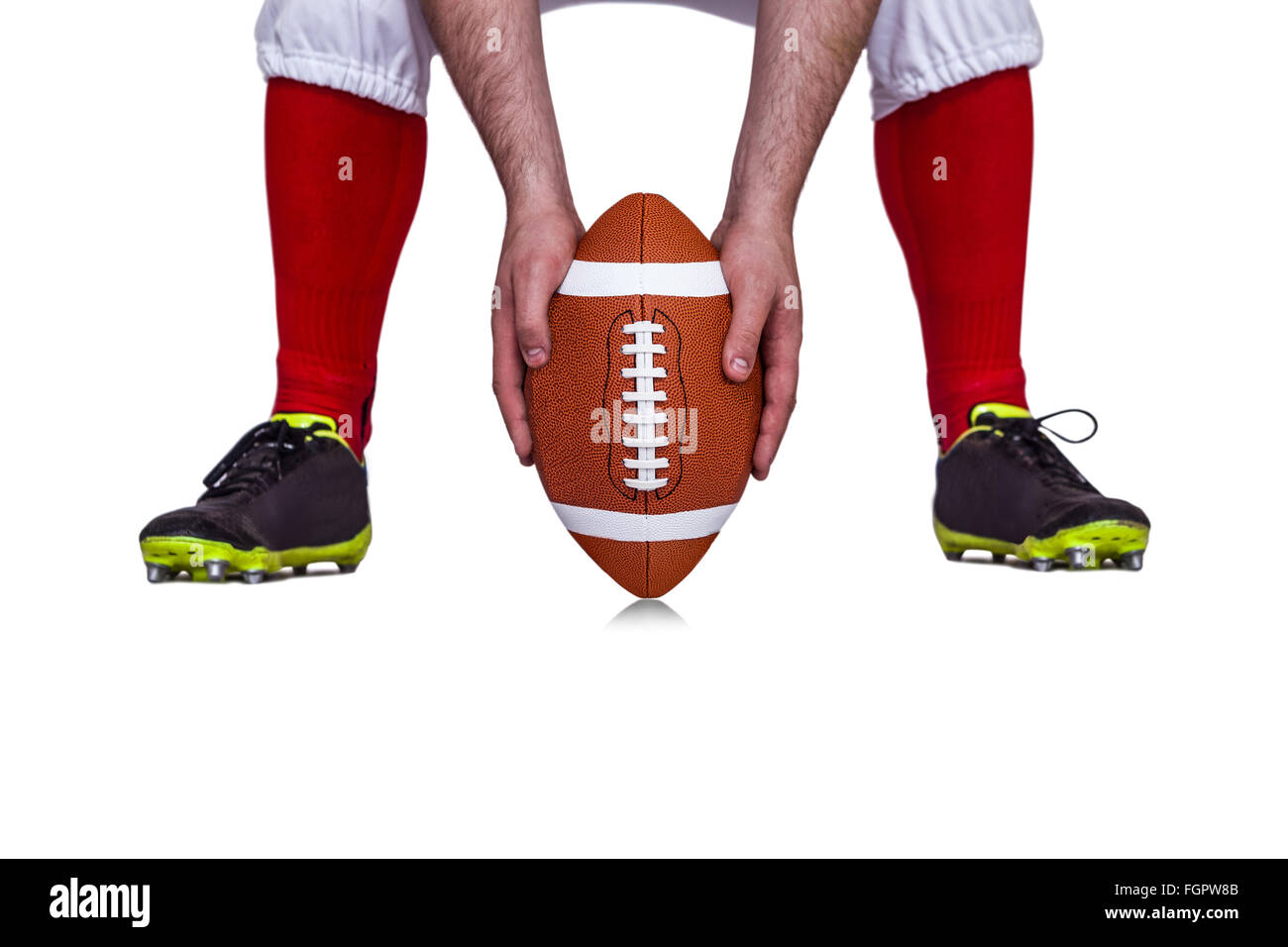 Joueur de football américain qui pousse le ballon Banque D'Images