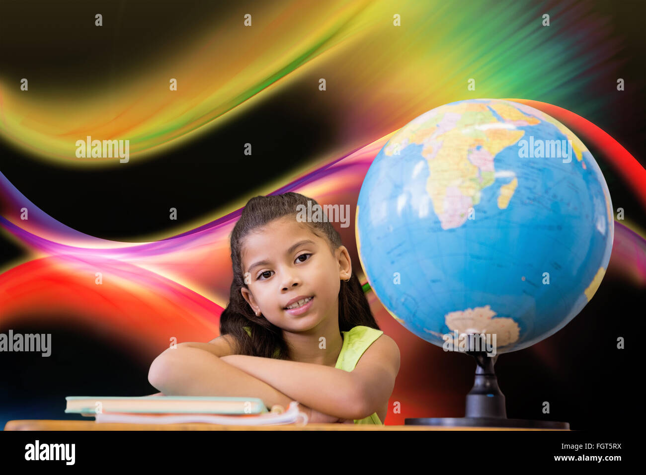 Image composite de cute pupils sitting at desk Banque D'Images