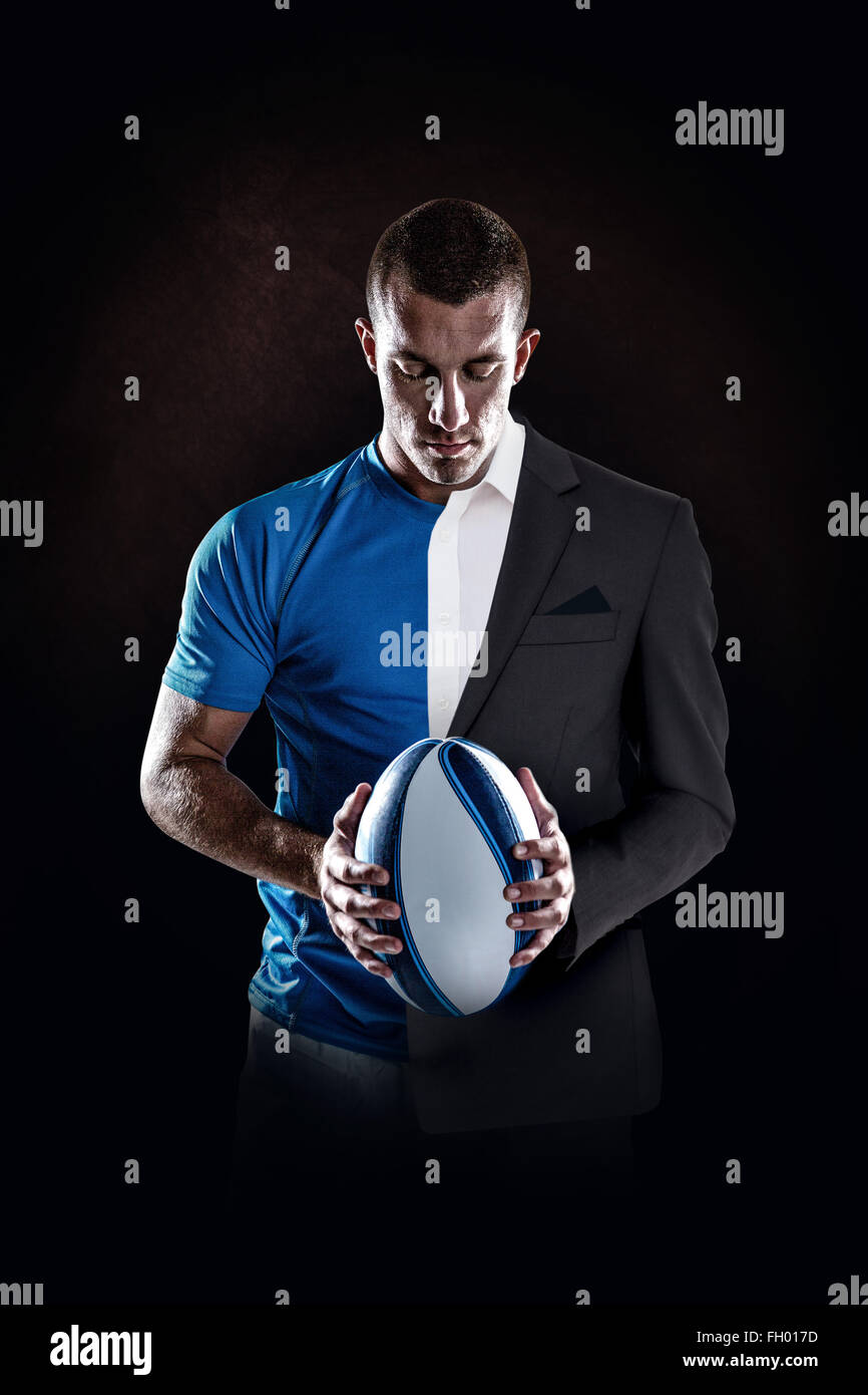 Image composite de rugby player holding ball Banque D'Images