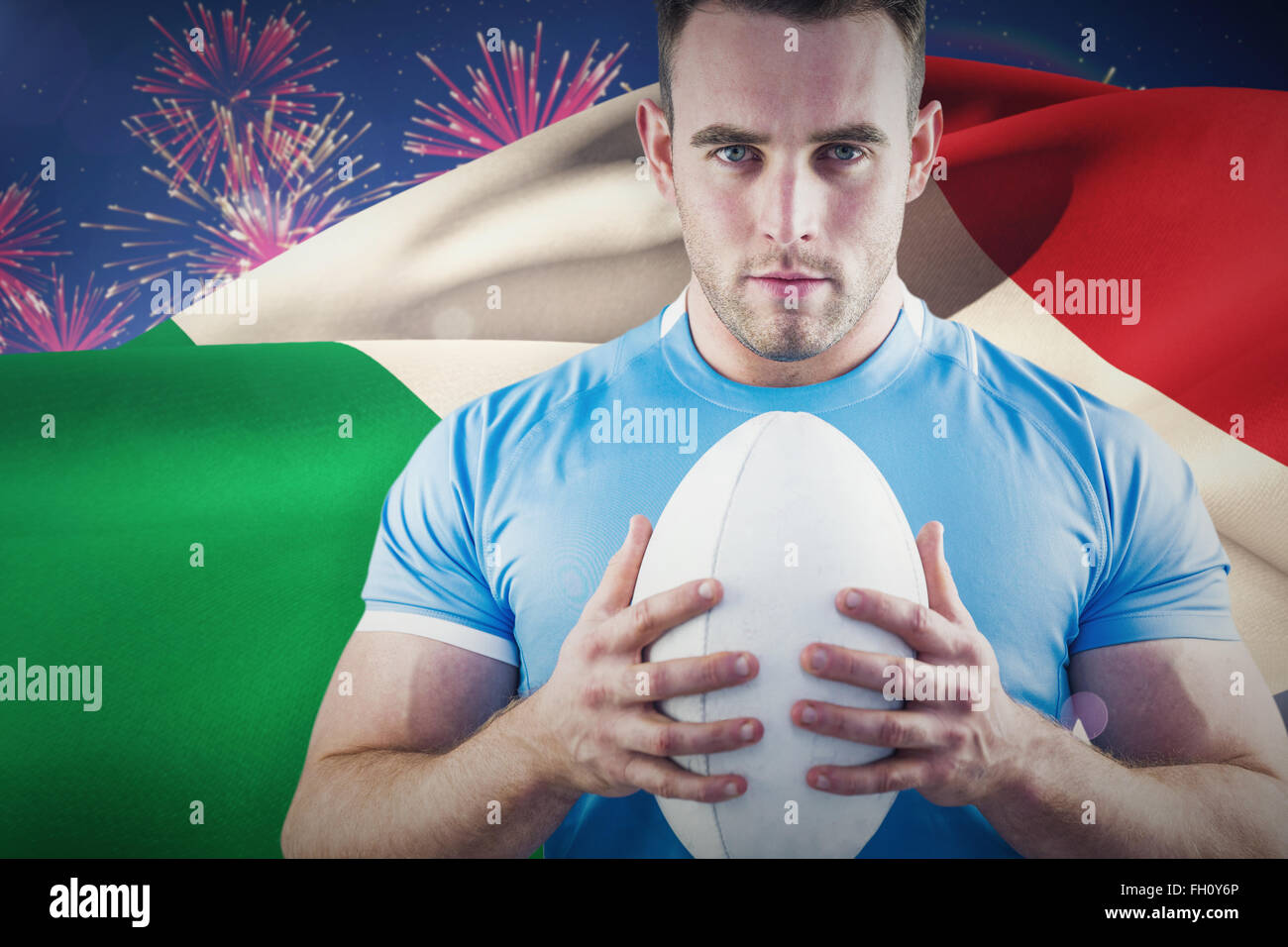 Image composite de rugby player looking at camera with ball Banque D'Images