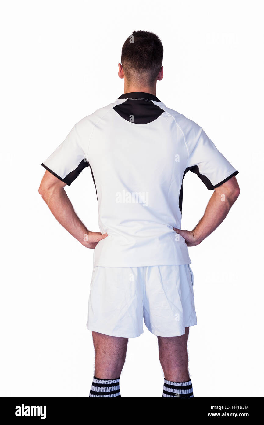 Vue arrière du joueur de rugby avec les bras sur la taille Banque D'Images