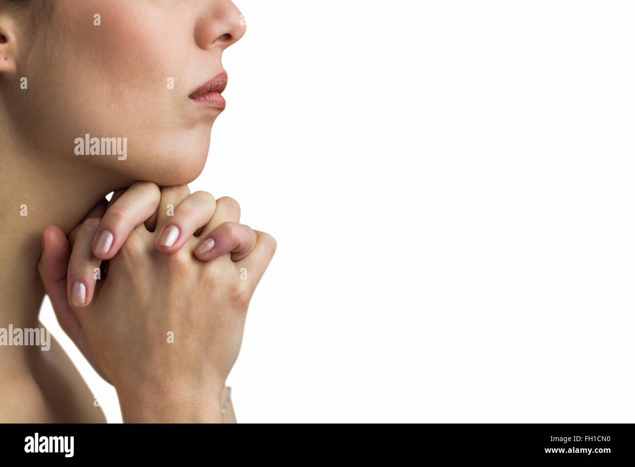 Portrait de femme en prière avec la main Banque D'Images