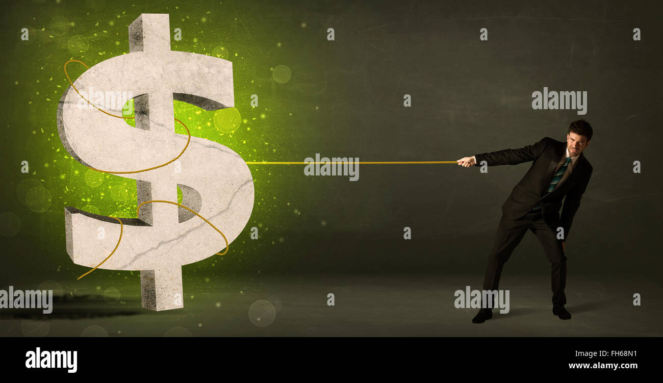 L'homme d'affaires en tirant un big green dollar sign Banque D'Images