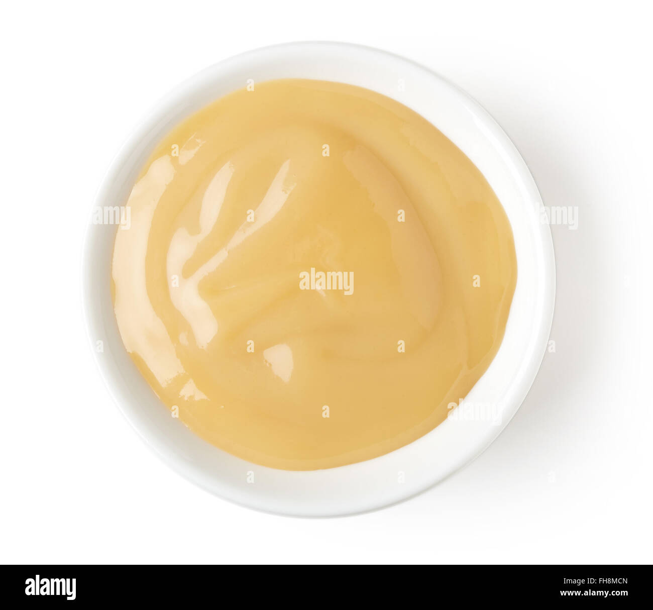 Bol de crème vanille sur fond blanc, vue du dessus Banque D'Images