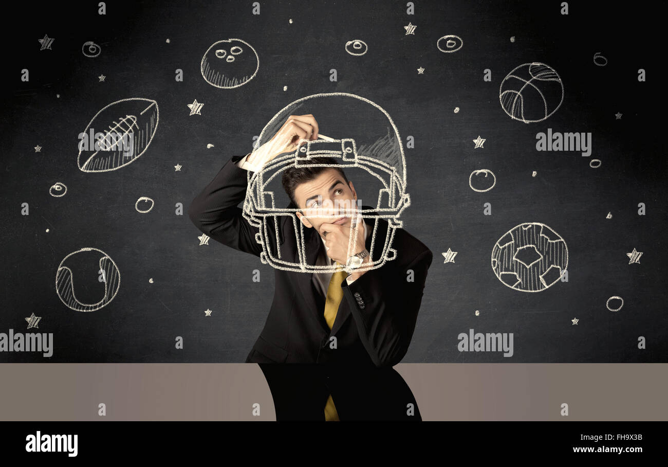 Businessman encombrement casque et sport balls Banque D'Images