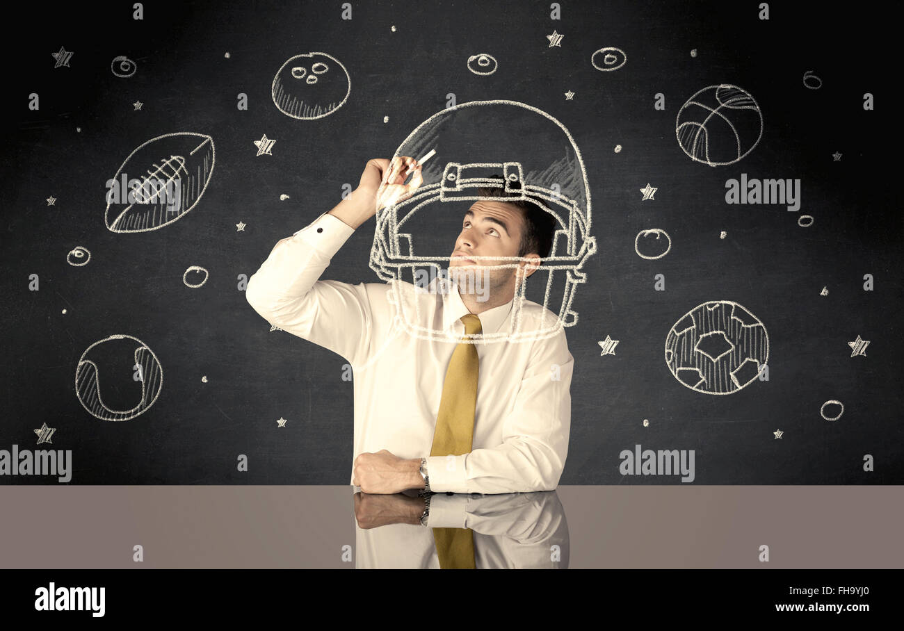 Businessman encombrement casque et sport balls Banque D'Images