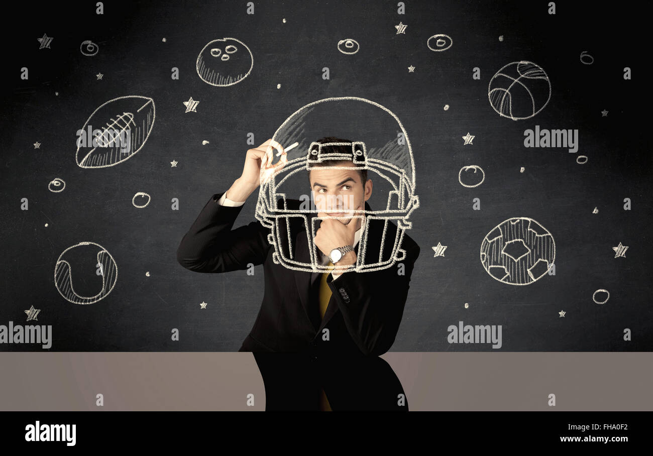 Businessman encombrement casque et sport balls Banque D'Images