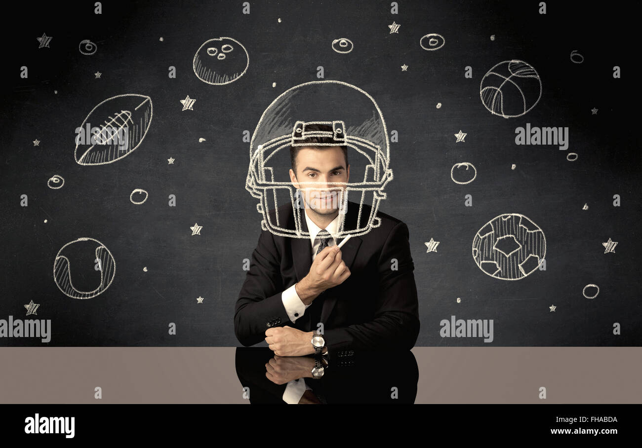 Businessman encombrement casque et sport balls Banque D'Images