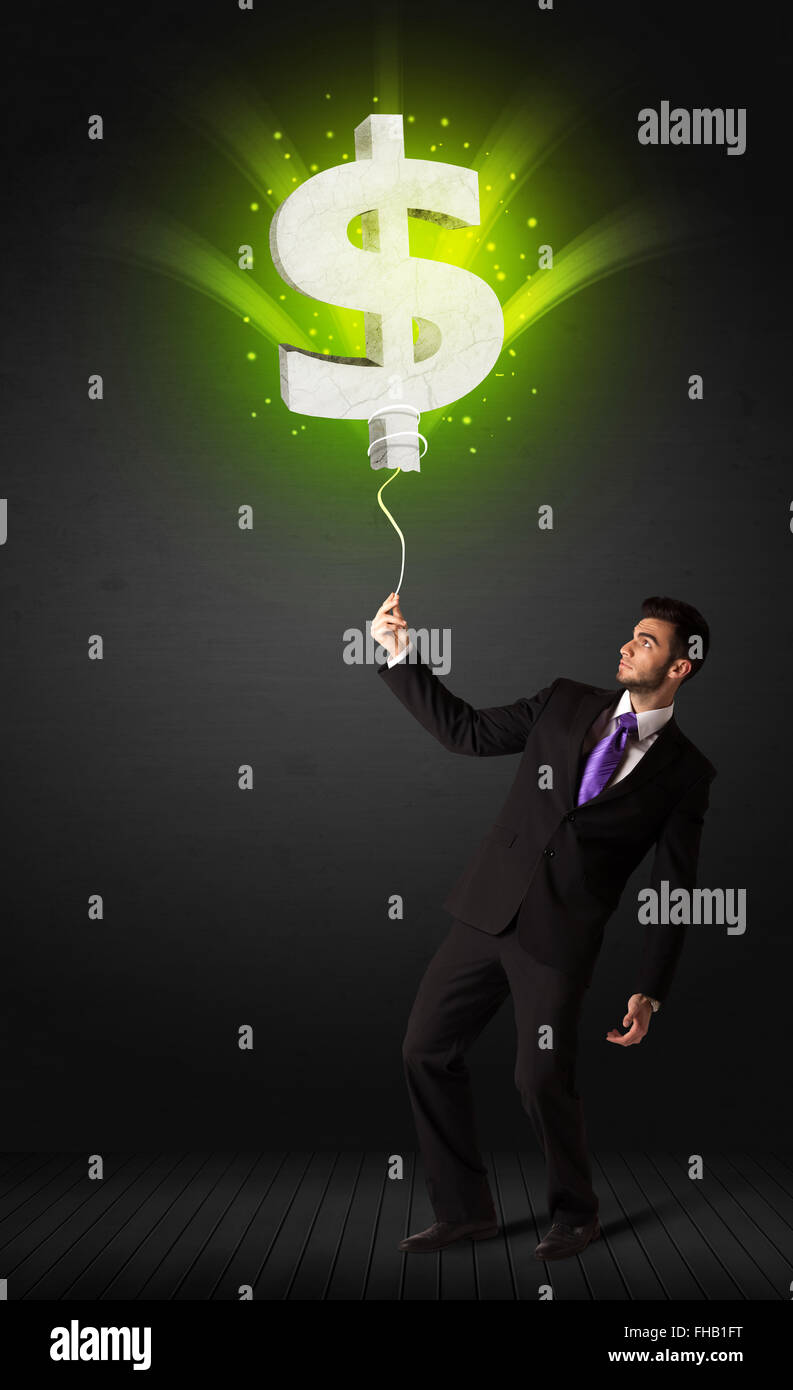 Businessman avec un signe dollar balloon Banque D'Images