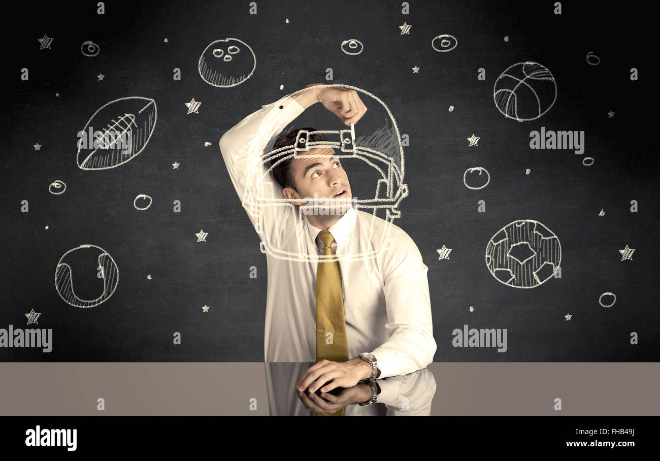 Businessman encombrement casque et sport balls Banque D'Images