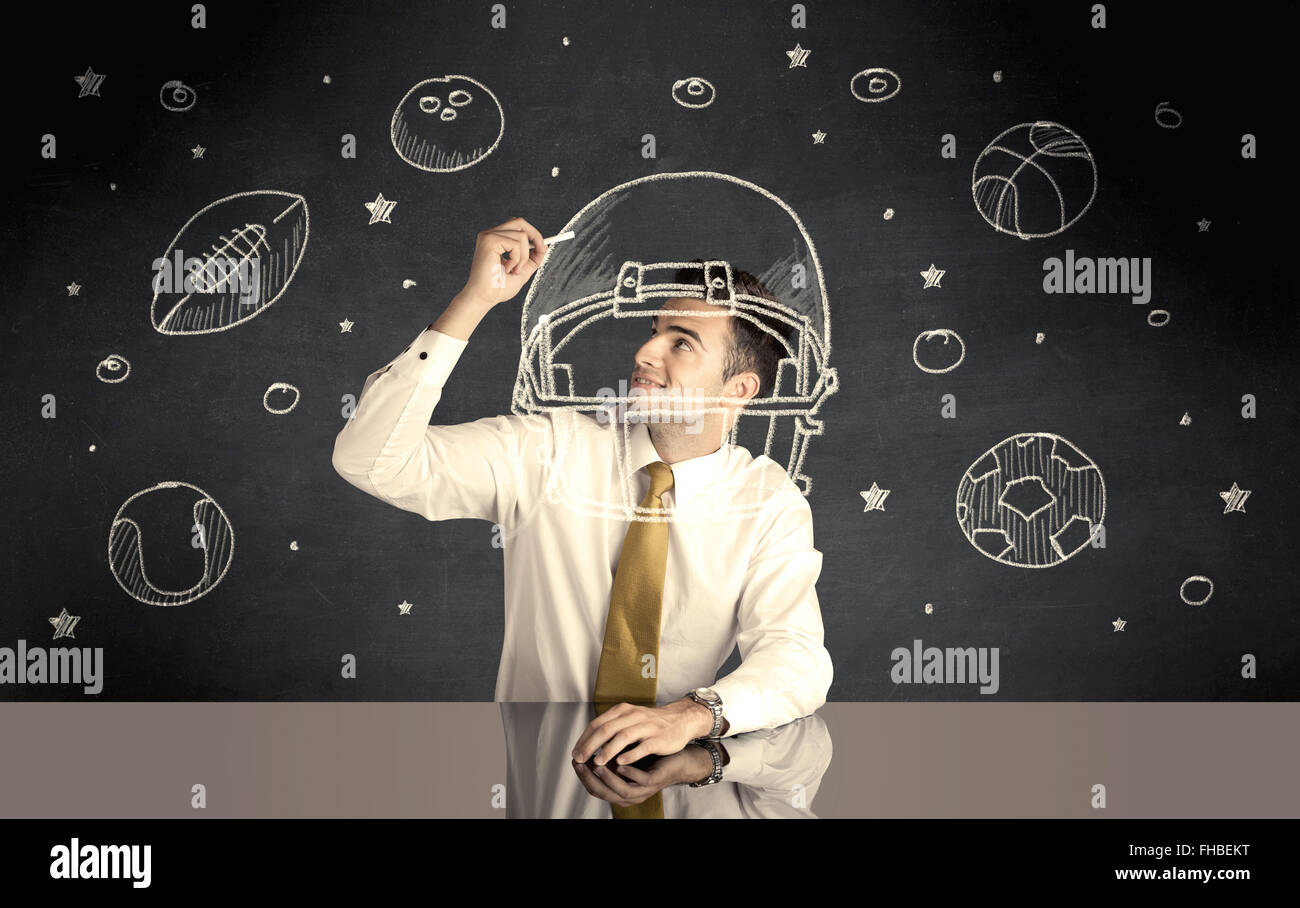 Businessman encombrement casque et sport balls Banque D'Images