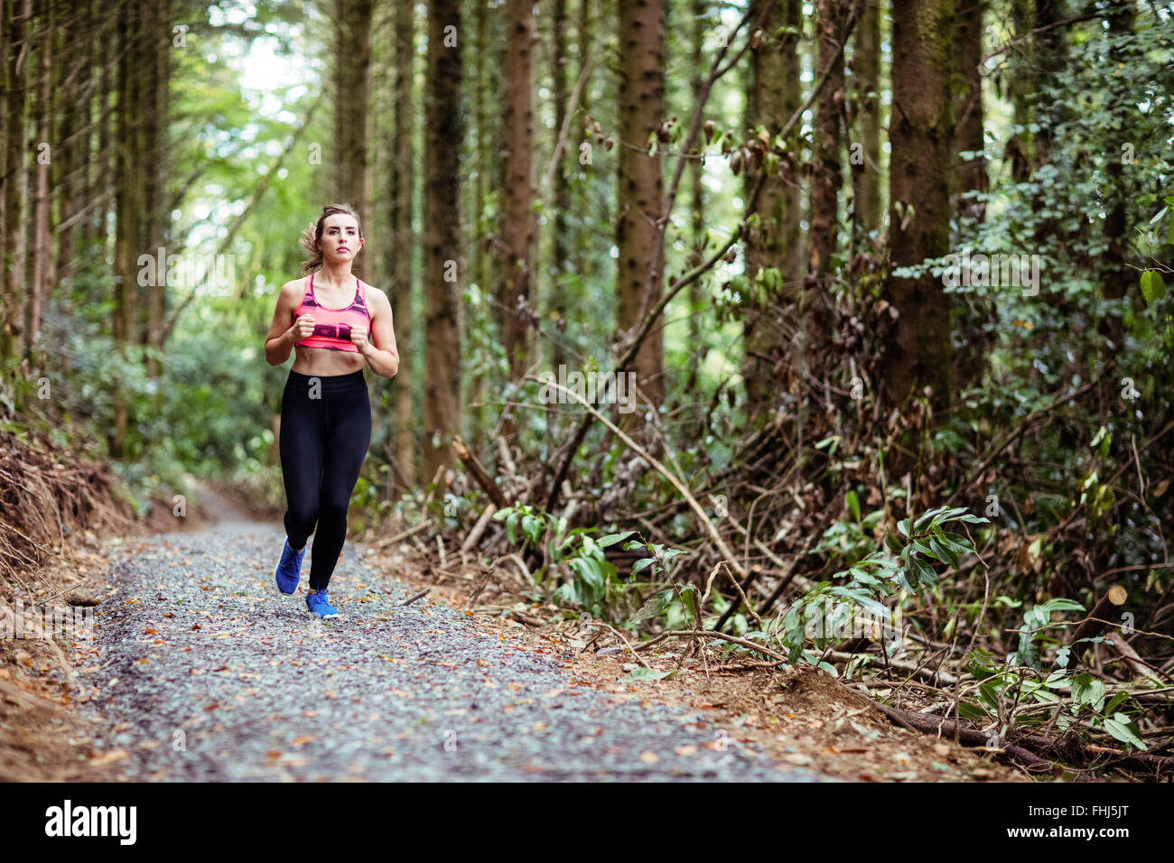 Jolie blonde woman running Banque D'Images