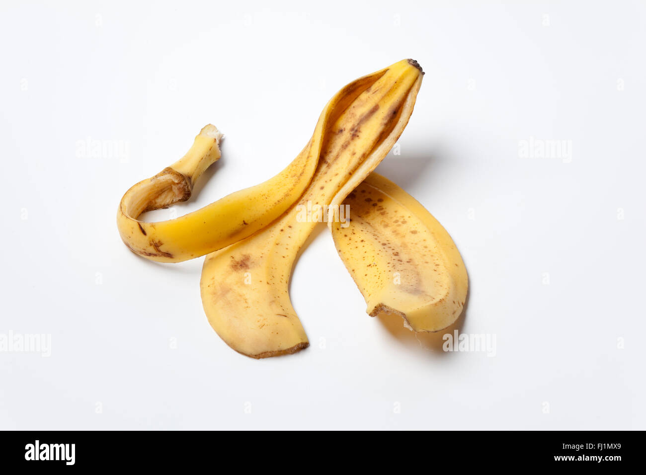 Peau de banane sur fond blanc Banque D'Images