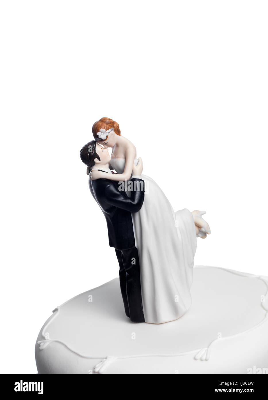 Mariée et le marié sur un gâteau de mariage Banque D'Images