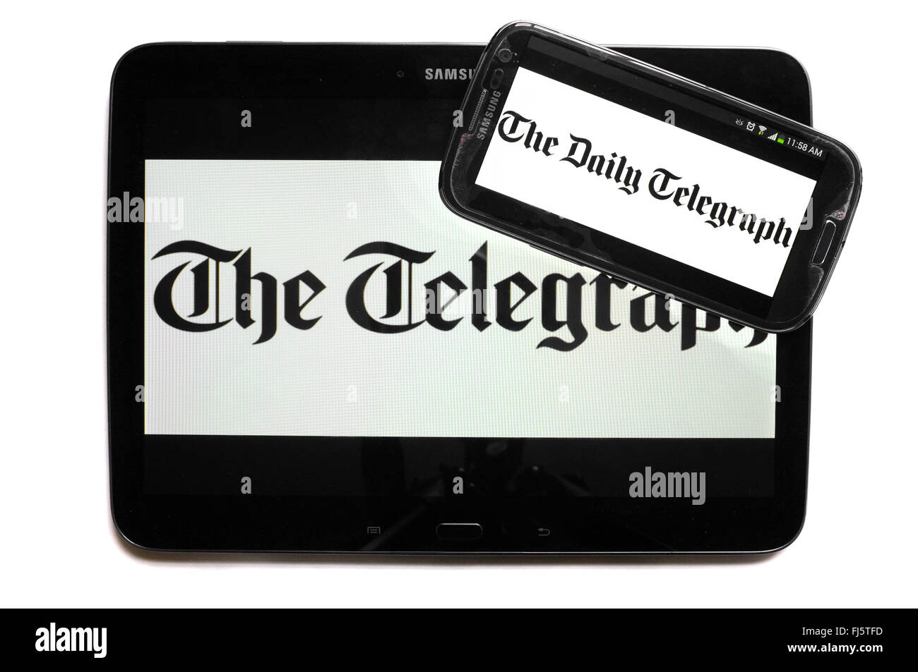 Le logo de la Telegraph apparaissant sur les écrans d'une tablette et un smartphone. Banque D'Images