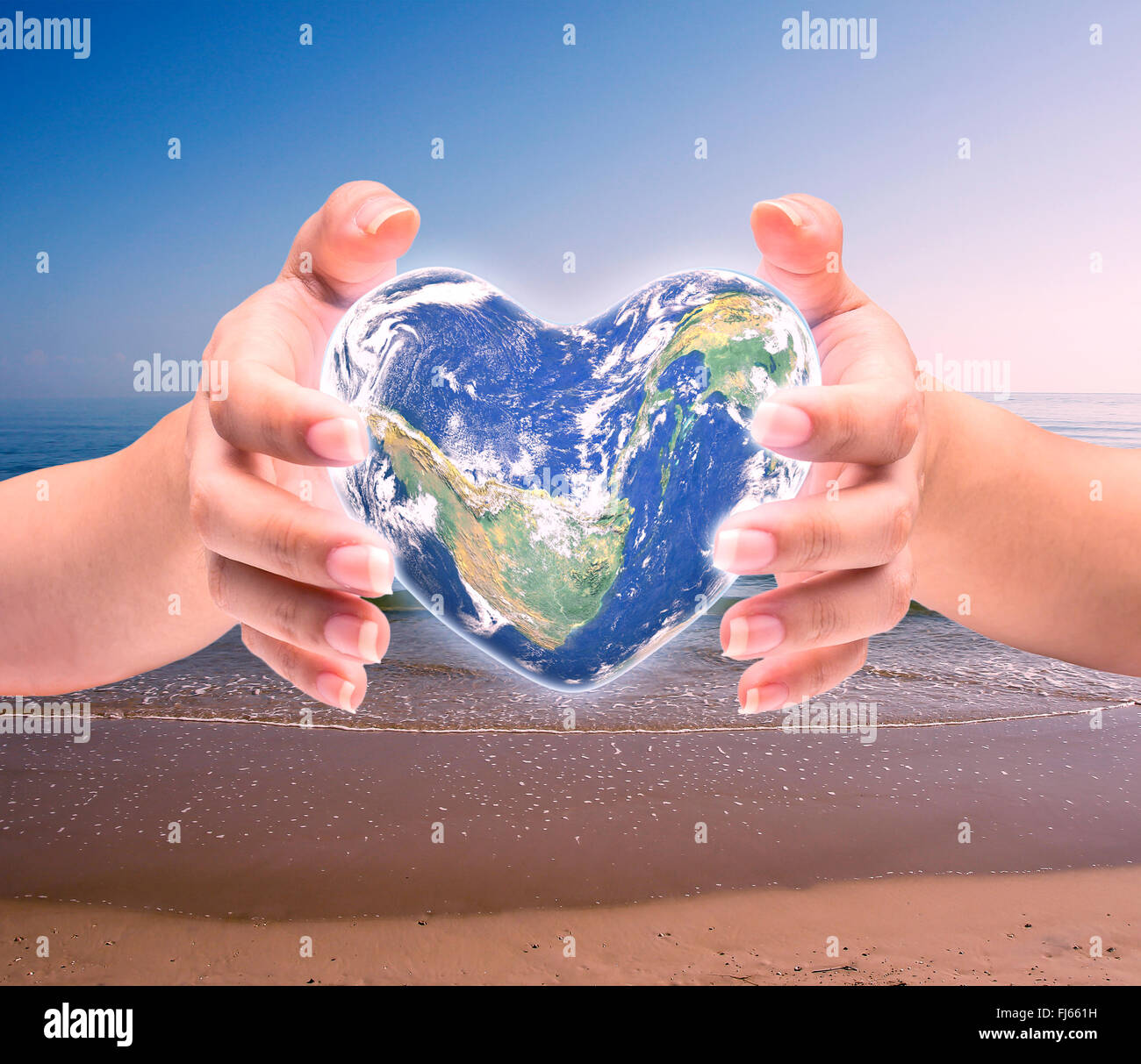 Monde en forme de coeur avec plus de femmes des mains d'homme sur fond naturel floue : la journée de la santé mondiale du Cœur,élément de cette image fur Banque D'Images