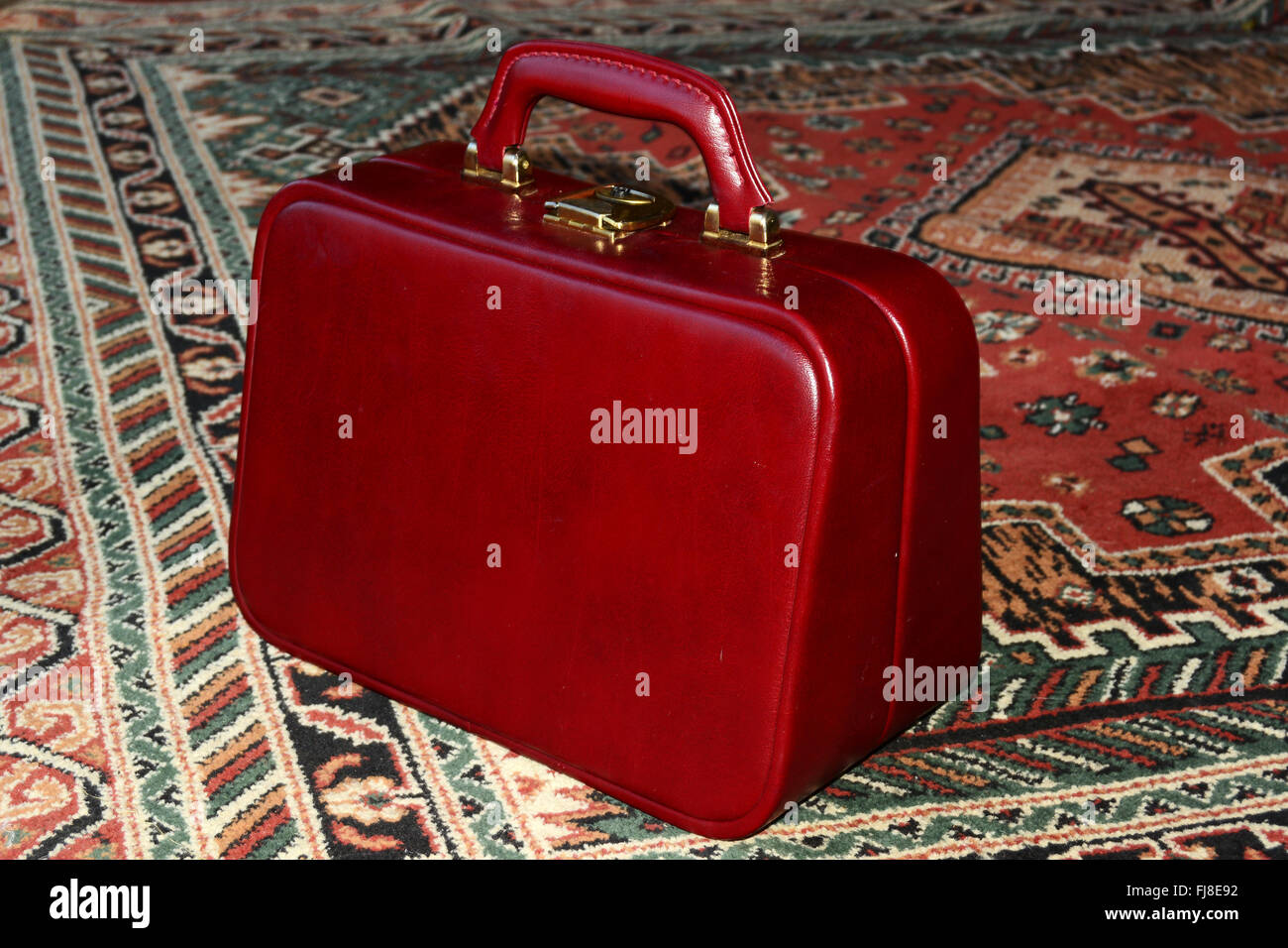 Bagages à main, le tapis rouge. La maison. Banque D'Images