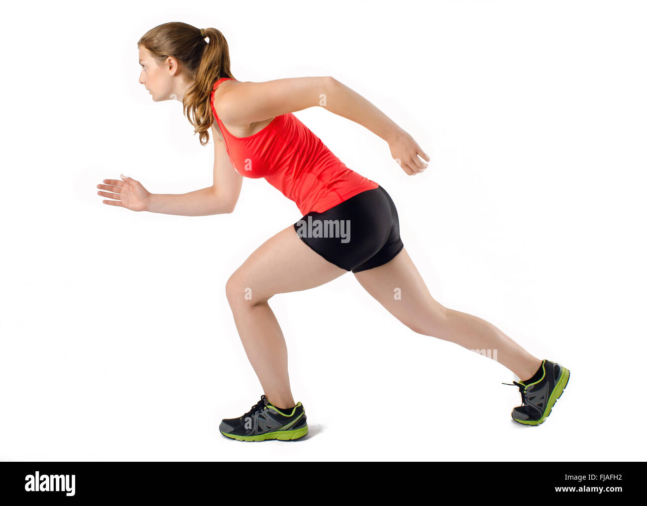 Young woman running sports athlétiques en profil. Isolé sur fond blanc. Banque D'Images