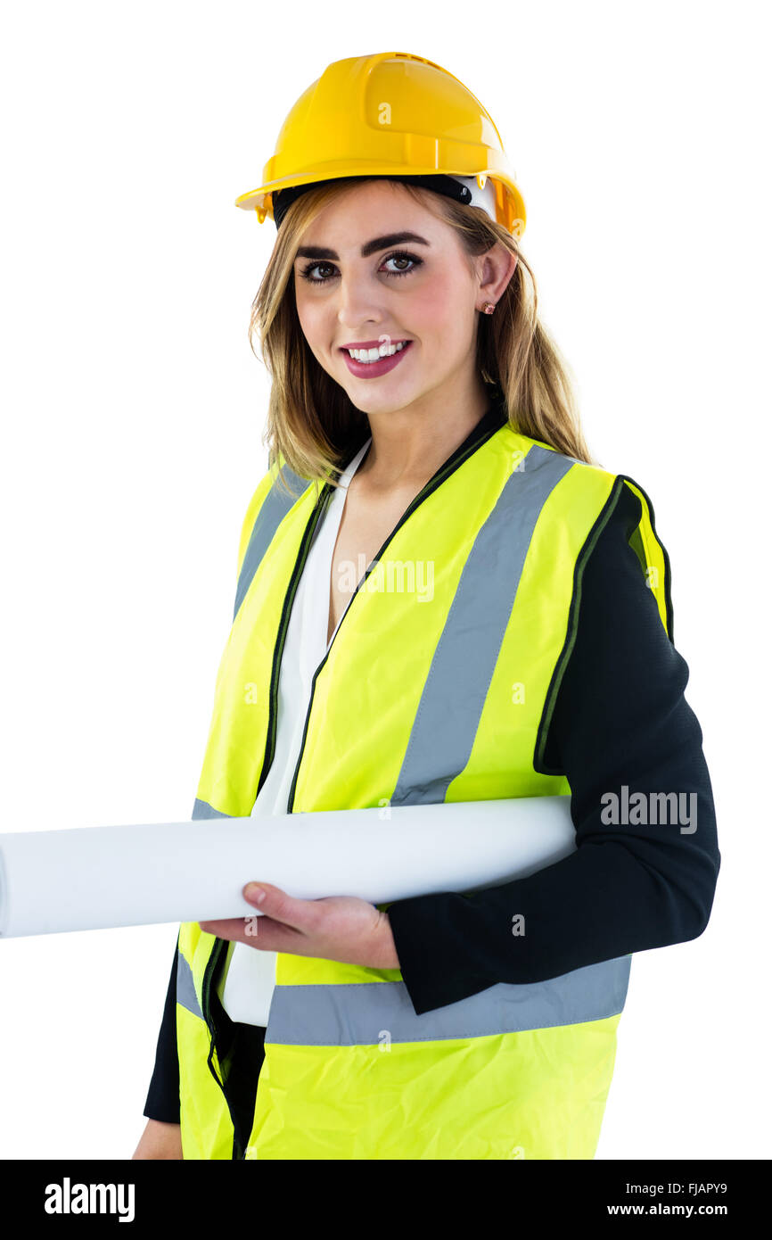 Smiling woman holding construction plan Banque D'Images