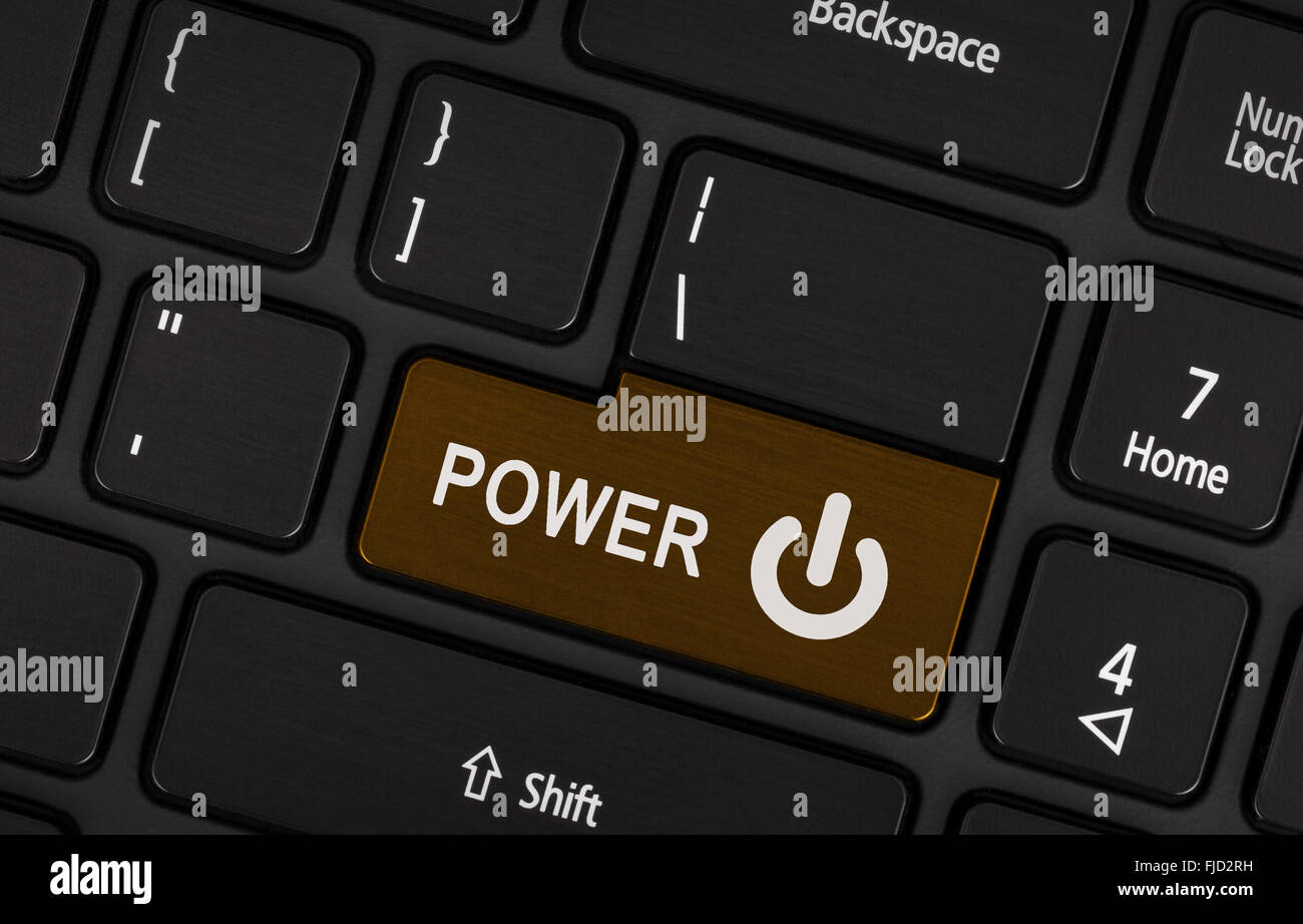 Close-up of a brown bouton d'alimentation sur un clavier d'ordinateur  portable noir Photo Stock - Alamy