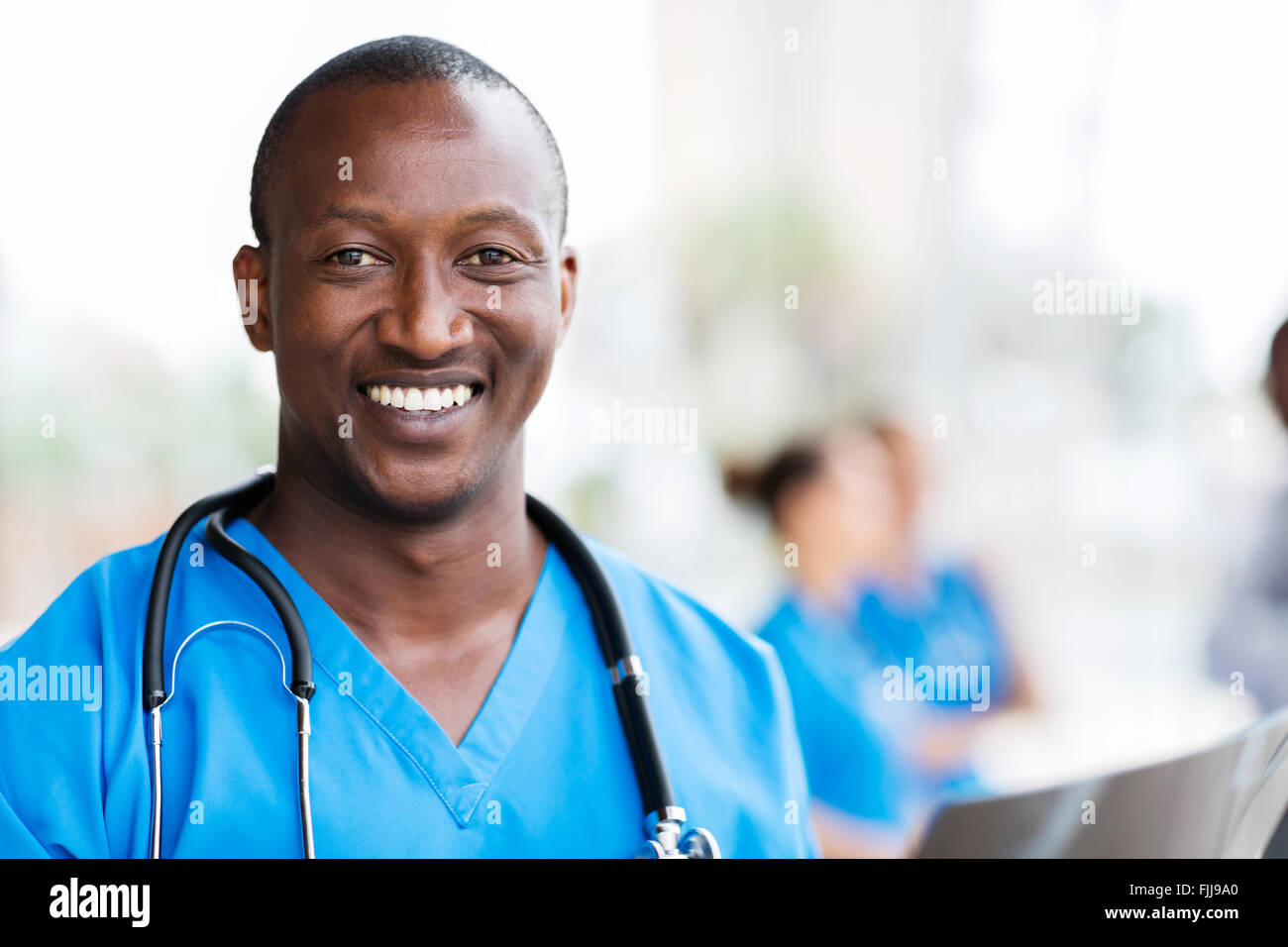 Smiling African Medical professional with stethoscope Banque D'Images