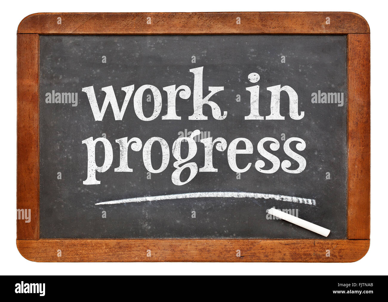 Travail en cours - texte de craie blanche sur un tableau noir ardoise vintage Banque D'Images