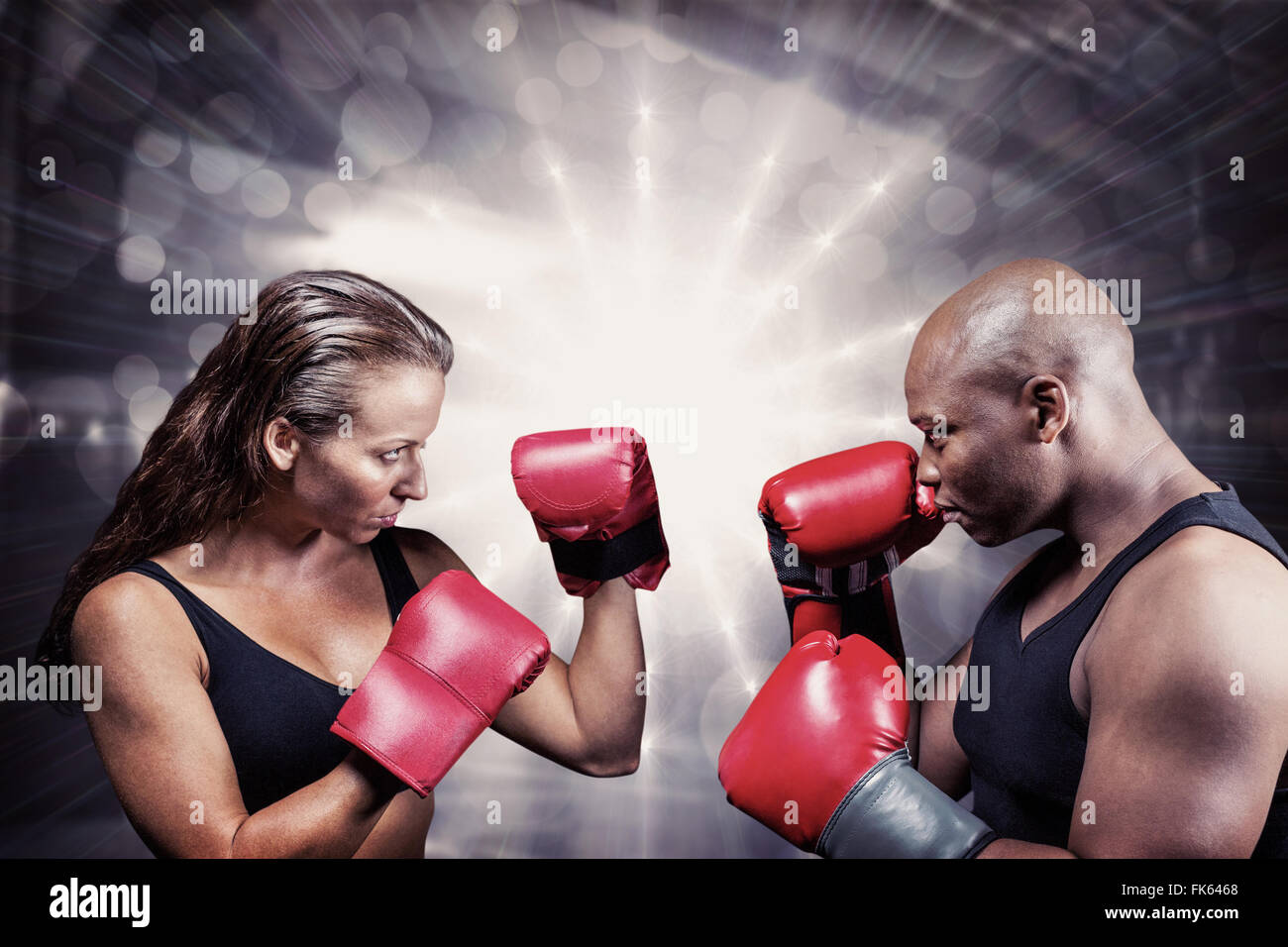 Image composite d'athlètes avec position de combat Banque D'Images Image composite d'athlètes avec position de combat Banque D'Images