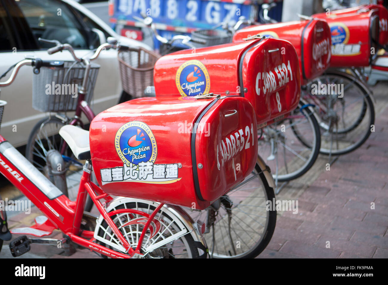 Livraison de pizza bicyclettes, Guangzhou, Chine Banque D'Images
