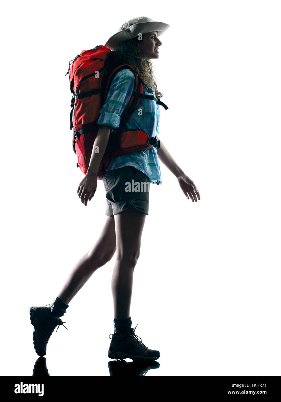 Un caucasian woman walking trekking trekker nature en silhouette isolé sur fond blanc Banque D'Images