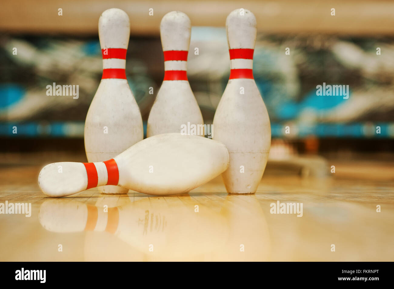 Quatre pions en bois Bowling Alley Banque D'Images