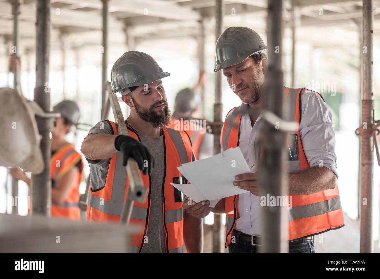Les constructeurs d'hommes plan on construction site Banque D'Images
