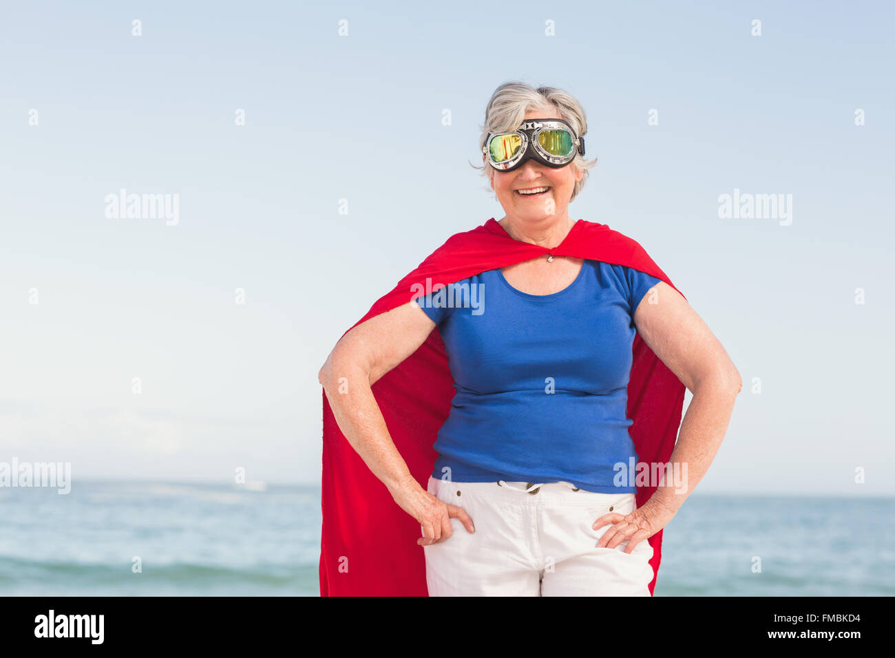 Senior woman wearing superwoman custome Banque D'Images