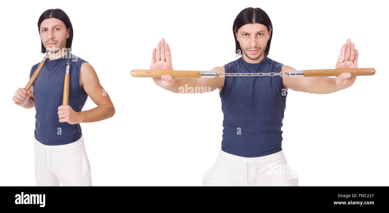 Funny karate fighter avec nunchucks on white Banque D'Images