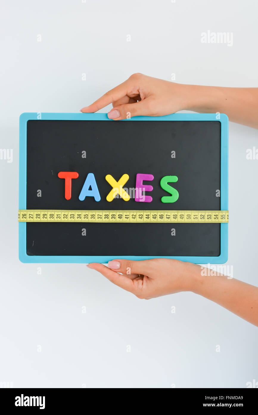 Mesurer la notion d'impôts dans le cadre d'une entreprise, la société ou l'économie Banque D'Images