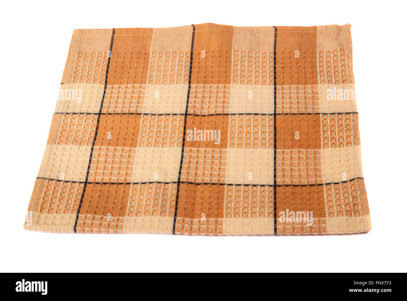 Serviette à carreaux pliée sur un fond blanc Banque D'Images