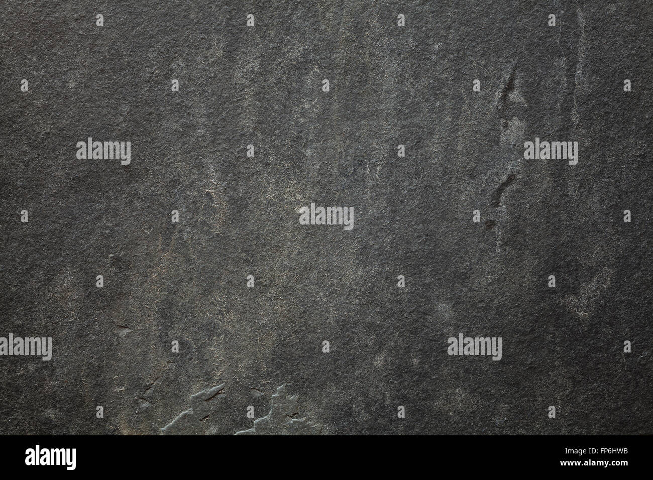 Pierre, l'ardoise sombre arrière-plan. Banque D'Images