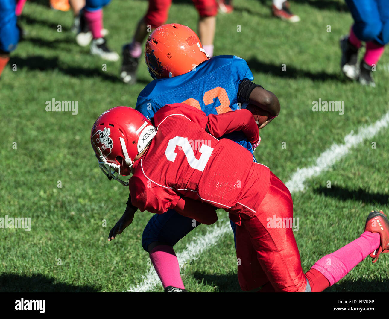 Football americain enfant Banque de photographies et d’images à haute