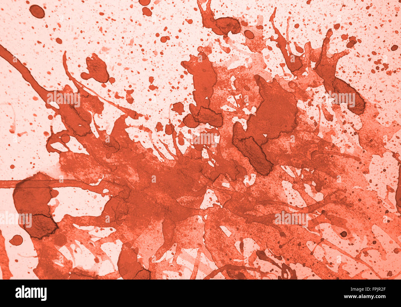 La couleur de l'eau orange abstrait avec des projections sur fond blanc Banque D'Images