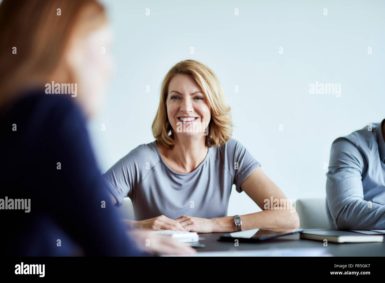 Confident businesswoman in meeting Banque D'Images