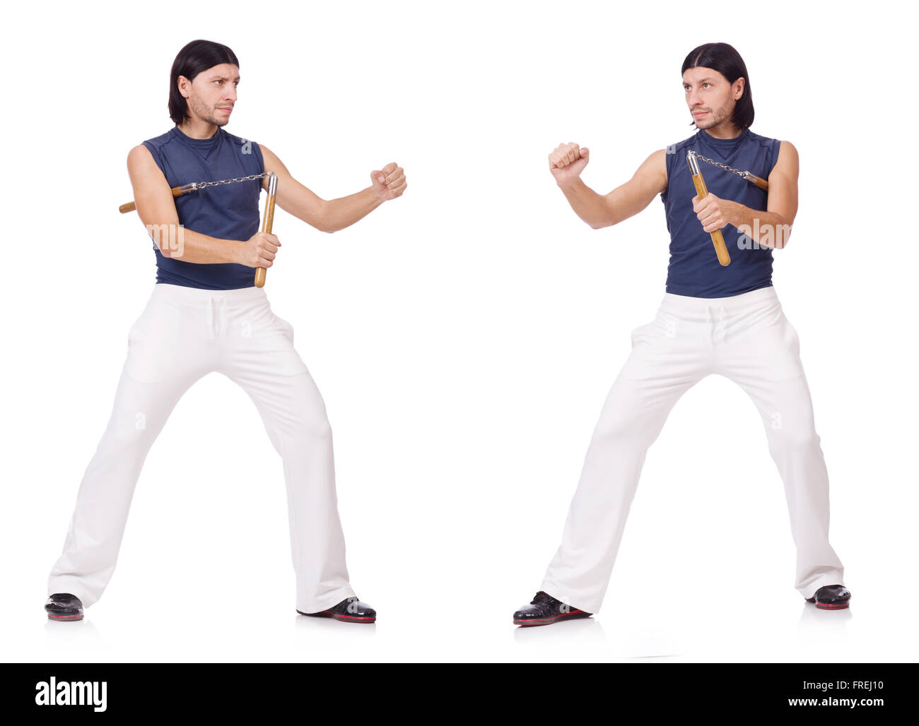 Funny karate fighter avec nunchucks on white Banque D'Images