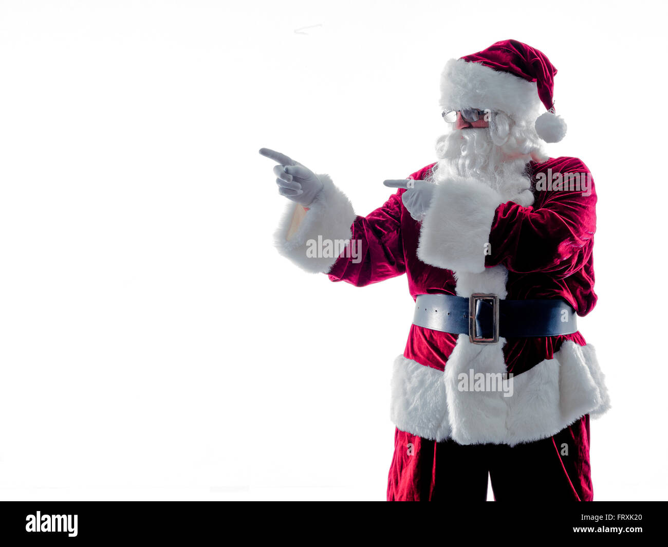 Un père noël man pointing silhouette isolé sur fond blanc Banque D'Images