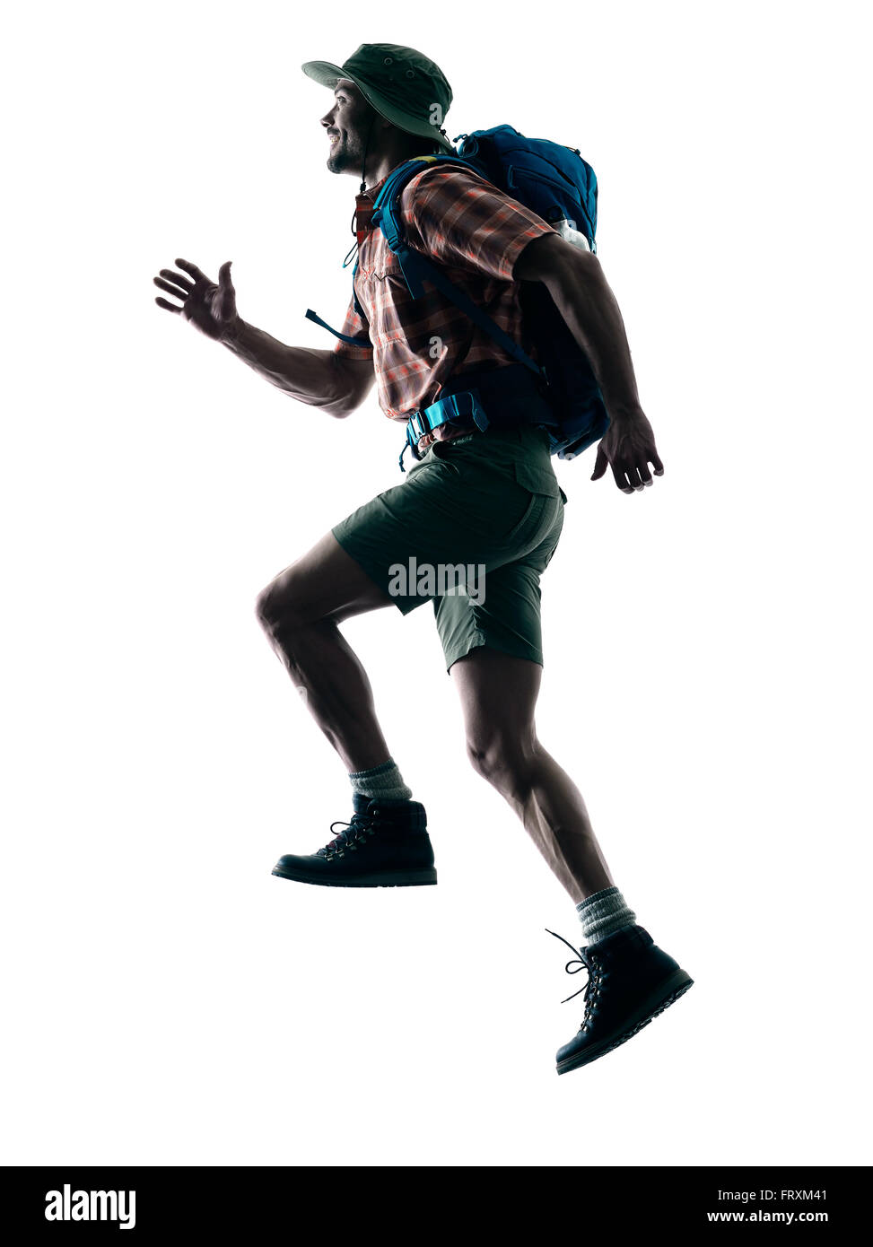 Un homme de race blanche trekker trekking running heureux en silhouette isolé sur fond blanc Banque D'Images