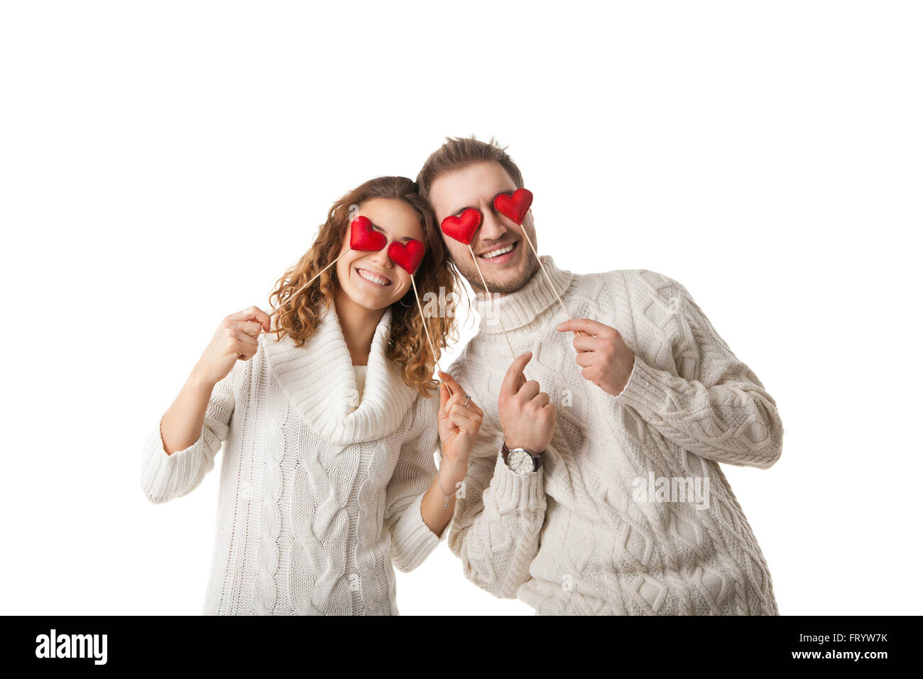 Coeurs joyeux couple holding par les yeux et rire Banque D'Images